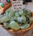 High Ho Gems and Crystals Prehnite Tumbled stones showcasing their beautiful light green color, perfect for crystal enthusiasts and collectors.