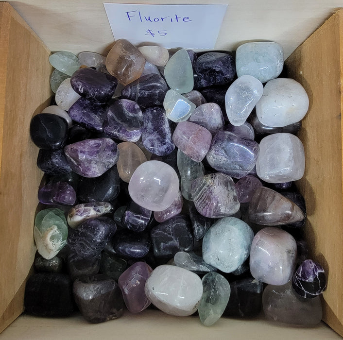 Beautiful Fluorite (Rainbow) tumbled stones from China, showcasing vibrant colors and unique patterns, perfect for healing and decorative purposes.