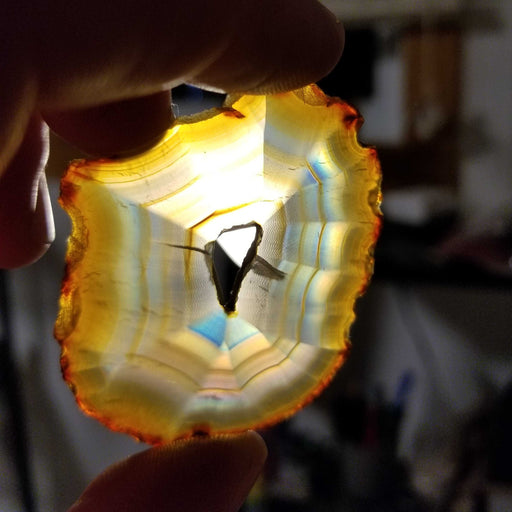 Beautiful Rainbow Iris Agate Slice showcasing vibrant colors and unique patterns, perfect for home decor.