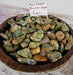 Stunning Rain Forest Rhyolite Jasper tumbled stones showcasing unique color patterns, ideal for crystal healing and decorative uses.