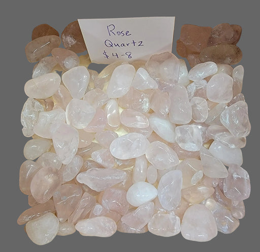 High-quality Rose Quartz tumbled stones showcasing their beautiful pink color and smooth texture, perfect for promoting love and healing energy.