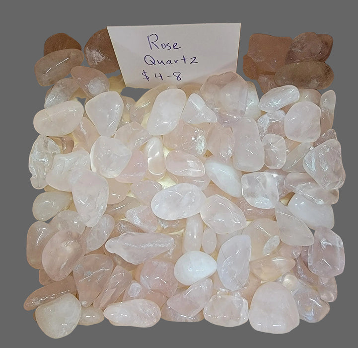 High-quality Rose Quartz tumbled stones showcasing their beautiful pink color and smooth texture, perfect for promoting love and healing energy.