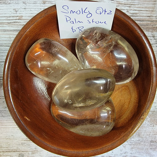 Beautiful Smoky Quartz palm stones from Brazil, perfect for calming energy and meditation.