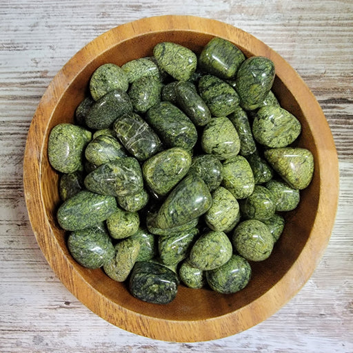Beautiful Snake Skin Jasper stone with green patterns resembling snake skin, known for its protective properties and grounding energy.