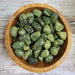 Beautiful Snake Skin Jasper stone with green patterns resembling snake skin, known for its protective properties and grounding energy.