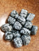 Tumbled stones featuring Snowflake Obsidian Tumbled, showcasing its unique black color with white dots, symbolizing purity and balance for body, mind, and spirit.