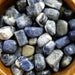 High-quality Sodalite tumbled stones showcasing beautiful blue and white colors. Perfect for emotional balance and enhancing intuitive abilities.