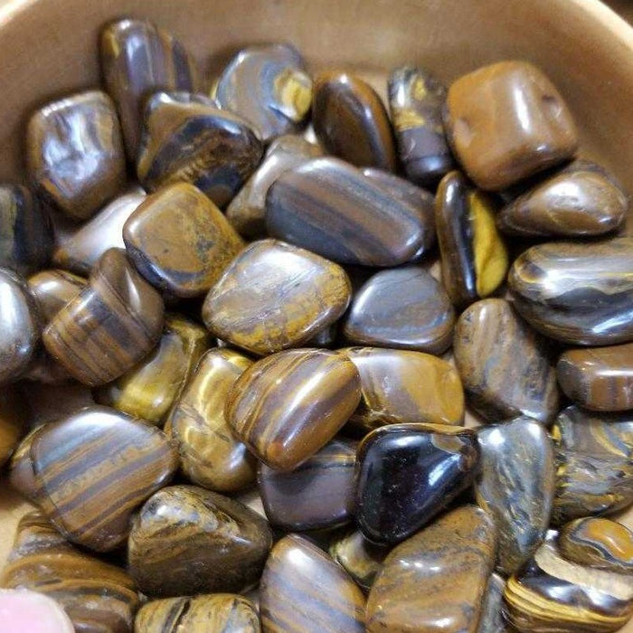 High Ho Gems and Crystals Tiger Iron tumbled stone, showcasing vibrant layers of golden tiger eye, red jasper, and black hematite for physical vitality and chakra grounding.