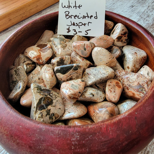 A beautiful piece of White Breciated Jasper Tumbled, showcasing its unique earthy patterns and colors, perfect for healing and wellness.