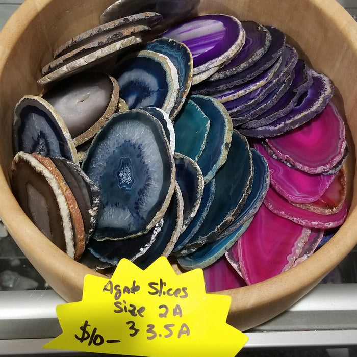 Artistic display of Polished Agate Slices Brazil, emphasizing the rich color variations and patterns.