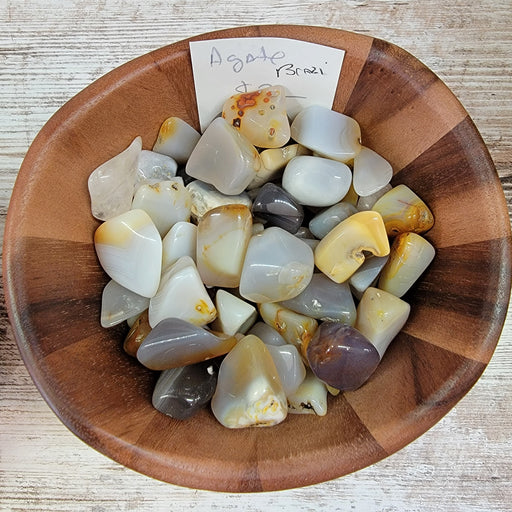 Natural Tumbled Agate Stones showcasing a variety of calming colors such as white, blue, red, and more. These Agate, Natural tumbled stones are perfect for energetic healing, grounding, and protection.
