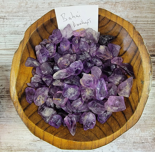 High-quality Bahai Amethyst tumbled stone showcasing its dark purple saturation from Brazil, perfect for healing and decoration.