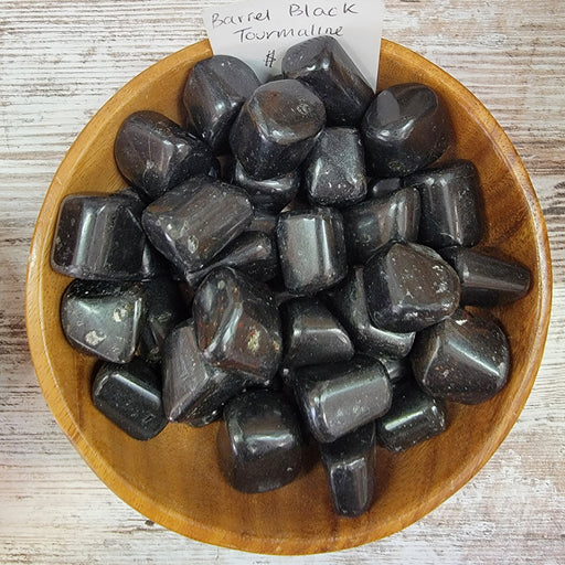 Black Tourmaline barrel shape crystal known for removing negative energies and promoting a good mood.