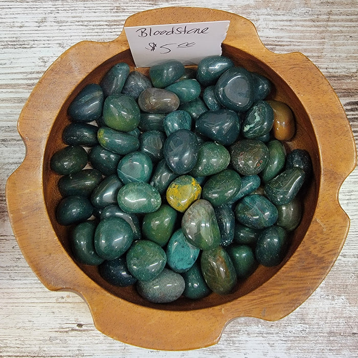 Beautiful Bloodstone tumbled stones showcasing rich green and red colors, perfect for healing and grounding energies.