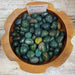Beautiful Bloodstone tumbled stones showcasing rich green and red colors, perfect for healing and grounding energies.
