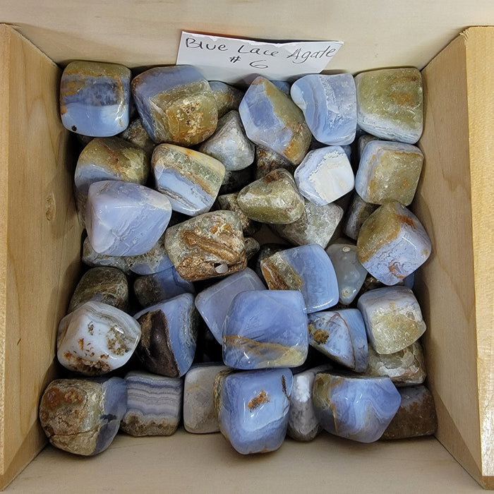 Beautiful Blue Lace Agate tumbled stones showcasing light blue and white colors, ideal for enhancing communication and promoting calmness.