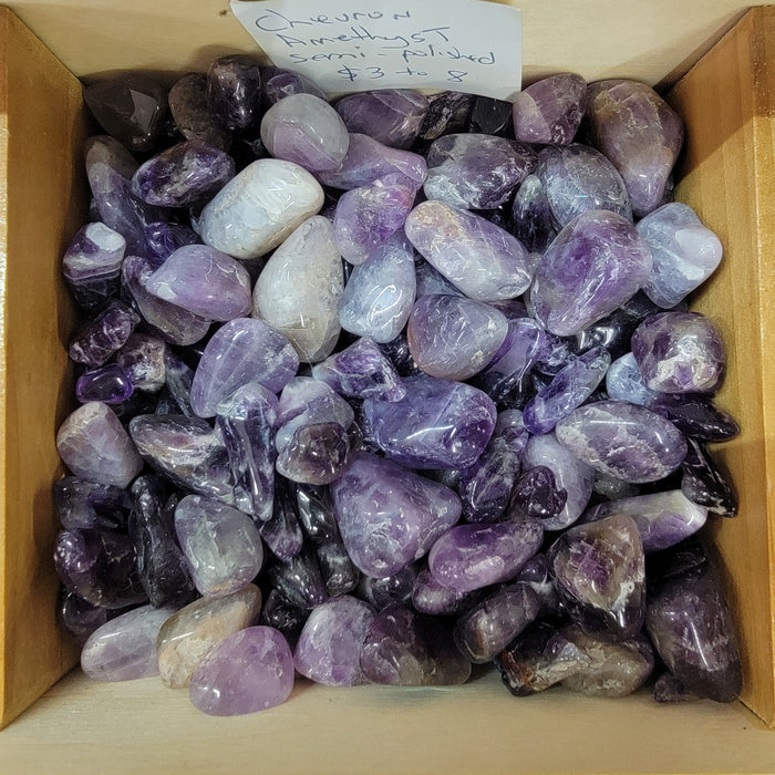 Chevron Amethyst tumbled - Beautiful purple crystal featuring unique triangular banding patterns, known for enhancing intuition and cleansing the aura.