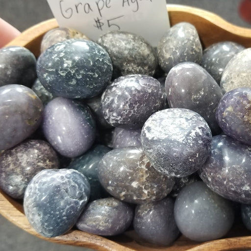 Beautiful Grape Agate tumbled crystals ideal for meditation and balancing chakras, known for promoting composure and inner stability.