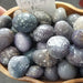 Beautiful Grape Agate tumbled crystals ideal for meditation and balancing chakras, known for promoting composure and inner stability.