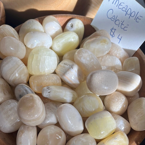 Beautiful Pineapple Calcite Tumbled gem, sourced from Pakistan, highlighting its stunning natural patterns and vibrant colors.