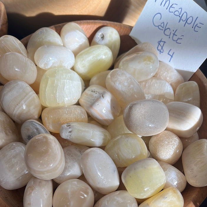 Beautiful Pineapple Calcite Tumbled gem, sourced from Pakistan, highlighting its stunning natural patterns and vibrant colors.