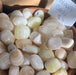 Beautiful Pineapple Calcite Tumbled gem, sourced from Pakistan, highlighting its stunning natural patterns and vibrant colors.