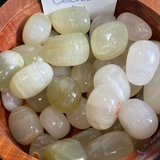 High-quality Green Calcite acid washed gemstone from Pakistan, showcasing its vibrant green color and unique texture.