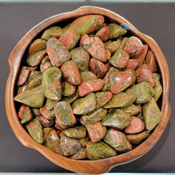 High-quality Unikite Tumbled stones showcasing a beautiful color range from pink to orange, red, and rusty brown, ideal for healing and chakra work.