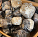 Beautifully polished Chocolate Calcite tumbled stone from Pakistan, perfect for crystal healing and decoration.