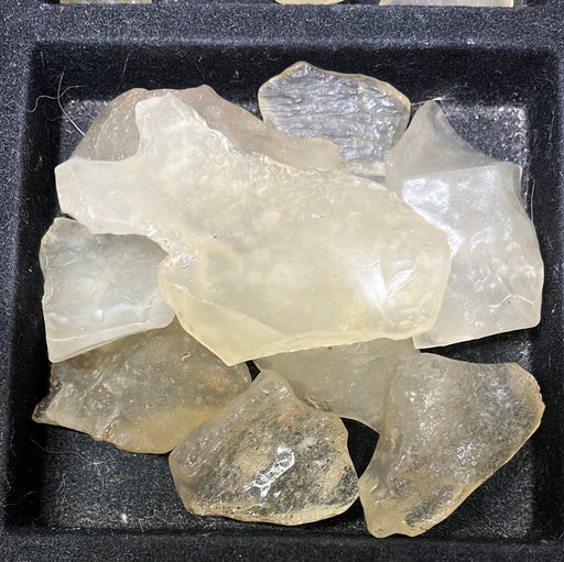 Tektite - Libyan Desert Glass showcasing its unique golden hue and natural formations, perfect for spiritual grounding and energy work.