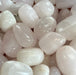 Beautiful Rose Pink Calcite Tumbled stones sourced from Pakistan, showcasing their soft pink hues and unique crystal formations.
