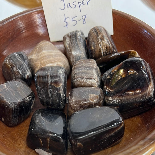 Close-up view of Chocolate Jasper tumbled stones, showcasing their unique purple color and natural texture, ideal for crystal collectors and healing enthusiasts.