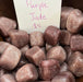 Beautiful Purple Jade Tumbled stones showcasing varying shades of purple, ideal for crystal healing and decoration from High Ho Gems and Crystals.