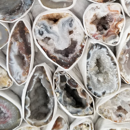 Stunning Oco Geode showcasing vibrant colors in black, brown, grey, and white, perfect for enhancing energy and meditation.