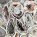 Stunning Oco Geode showcasing vibrant colors in black, brown, grey, and white, perfect for enhancing energy and meditation.