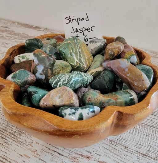 Beautiful Striped Jasper Tumbled stones showcasing unique colors and patterns, perfect for crystal healing and collection.
