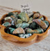 Beautiful Striped Jasper Tumbled stones showcasing unique colors and patterns, perfect for crystal healing and collection.