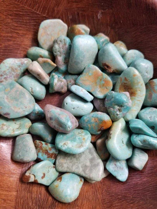 Beautiful Tumbled stones - Turquoise, showcasing vibrant green to teal blue colors perfect for enhancing creativity and emotional balance, ideal for collectors and crystal enthusiasts.