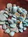Beautiful Tumbled stones - Turquoise, showcasing vibrant green to teal blue colors perfect for enhancing creativity and emotional balance, ideal for collectors and crystal enthusiasts.